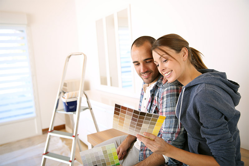 Couple Deciding On Paint Colors For A Room