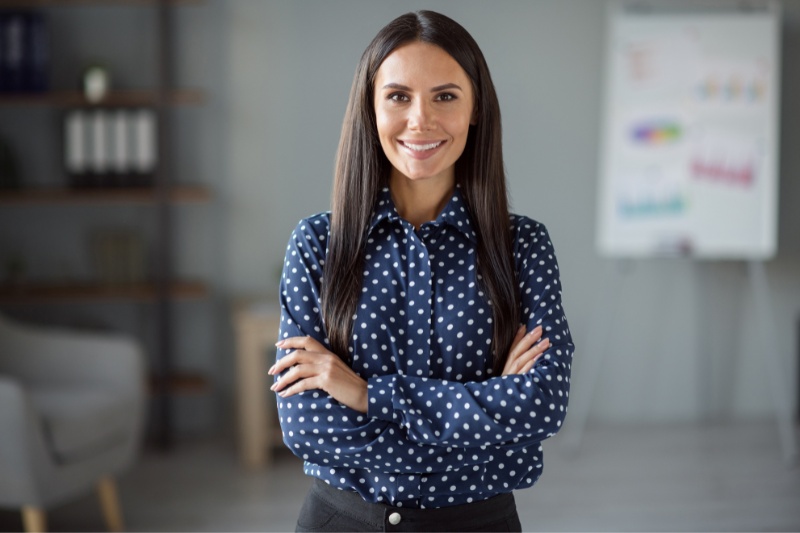 Businesswoman In Blue And White Polka Dot Shirt