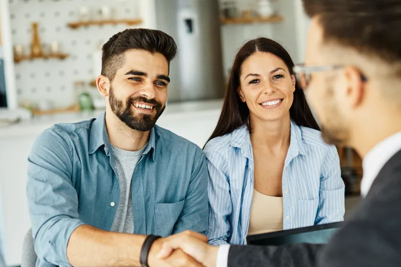 Couple Getting Advice From Mortgage Professional